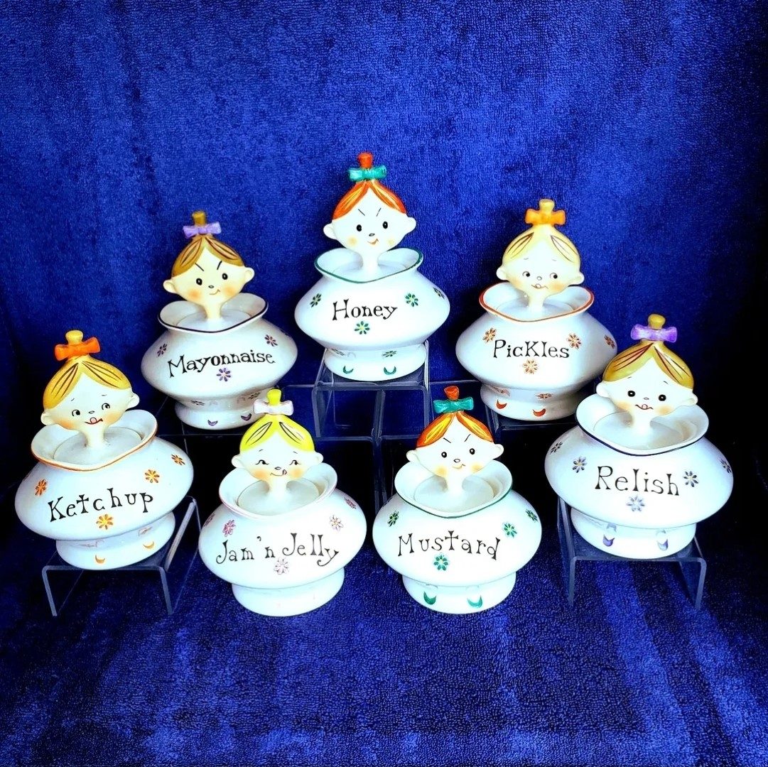 Seven Jolly Floral Girls condiment jars together