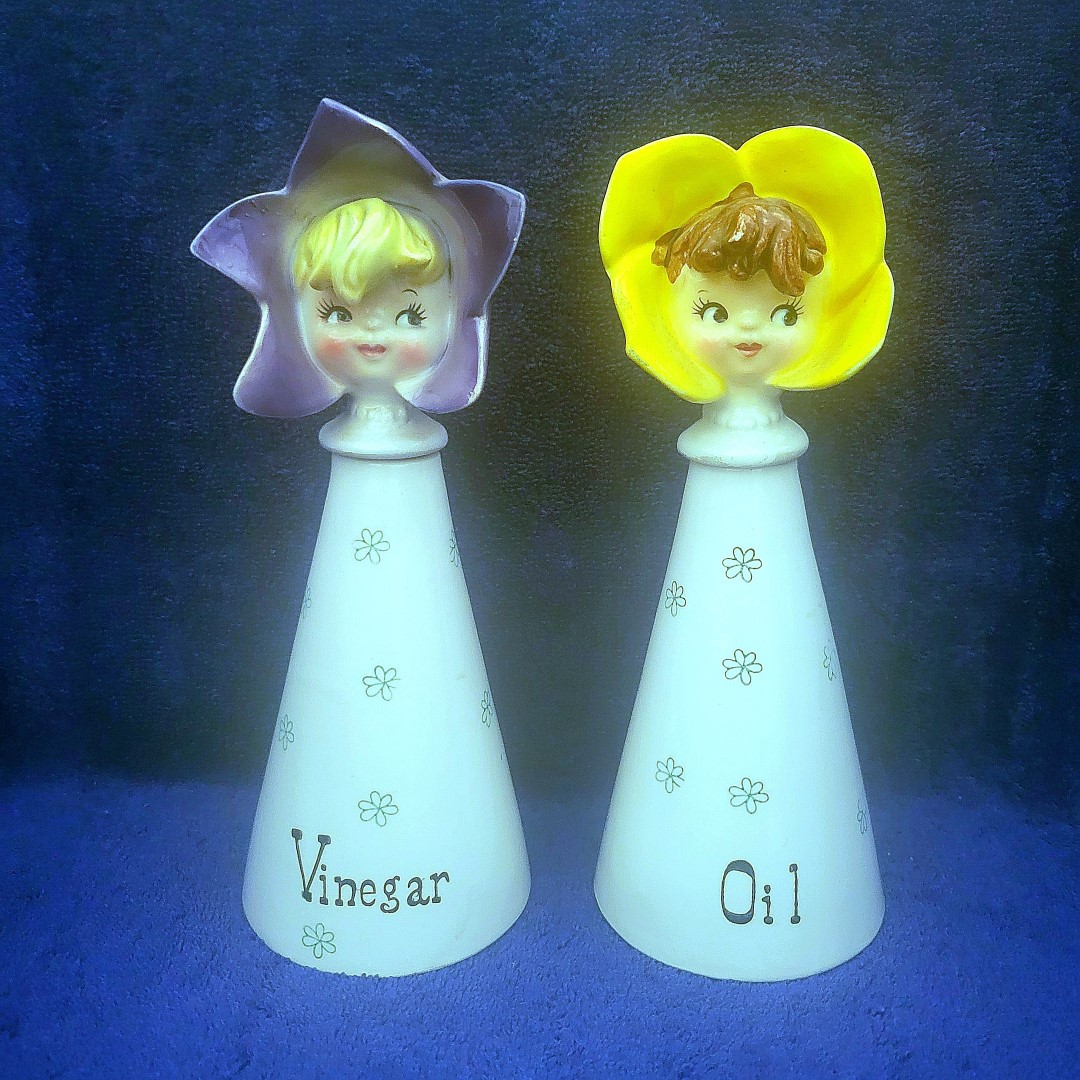 Oil and Vinegar cruets, with cork-sealed flower-head stoppers.
