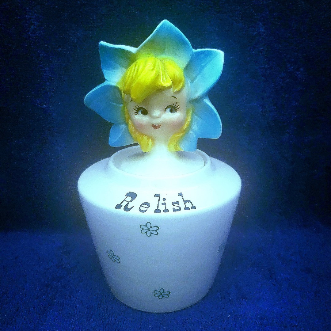 Relish, with a blue seven-petaled flower bonnet.