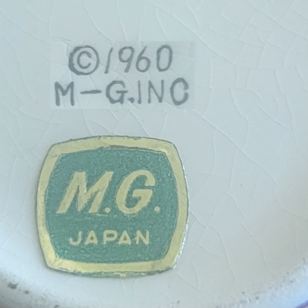 M-G Inc copyright mark and M.G. Japan foil sticker.