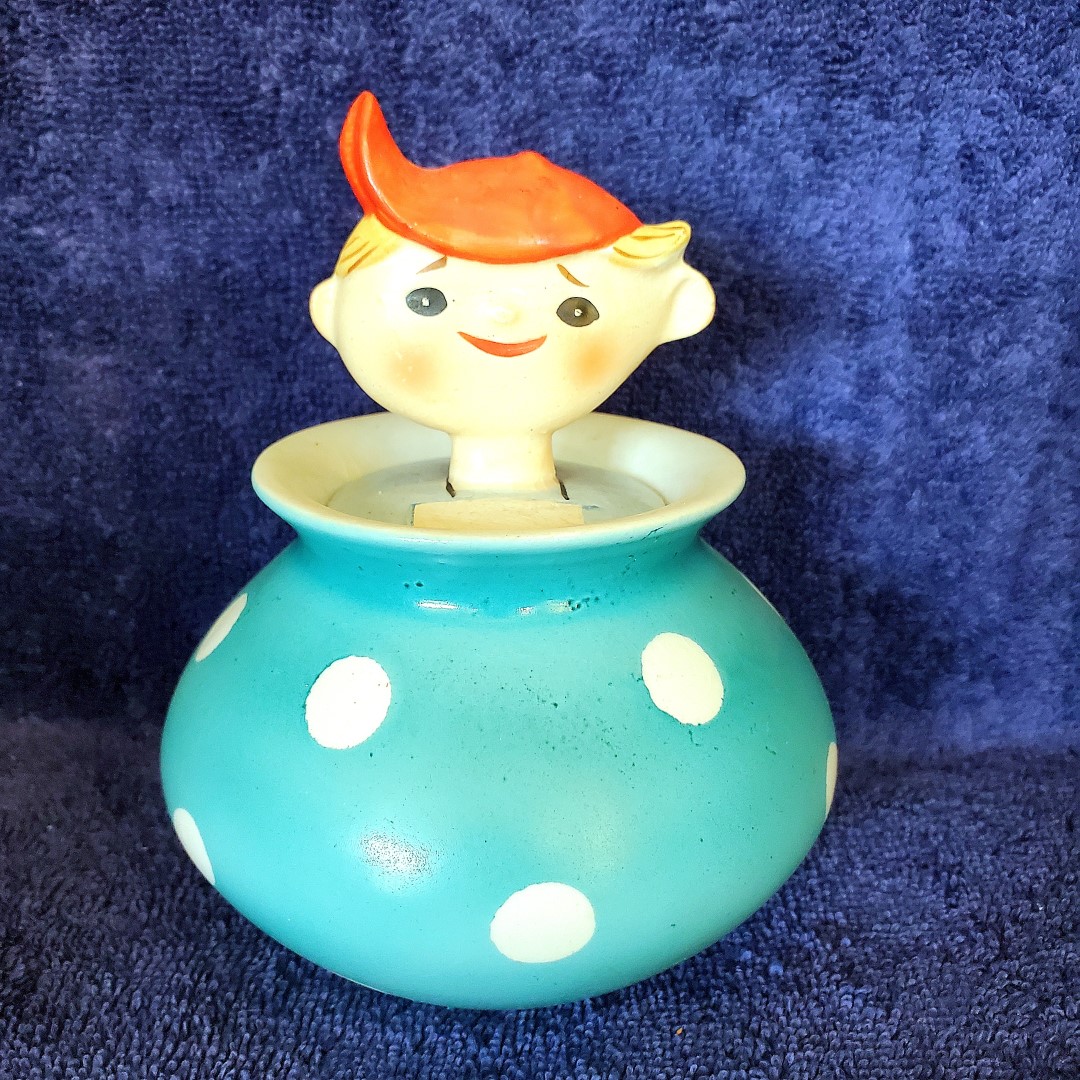 Boy jar with blue polka-dot body.