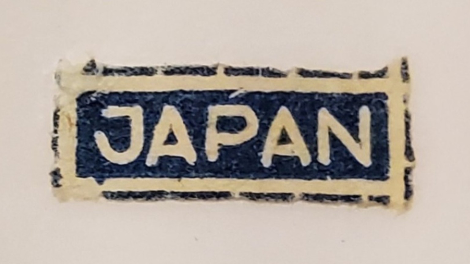 Rectangular Japan label on the underside of the Jam ’n Jelly jar.