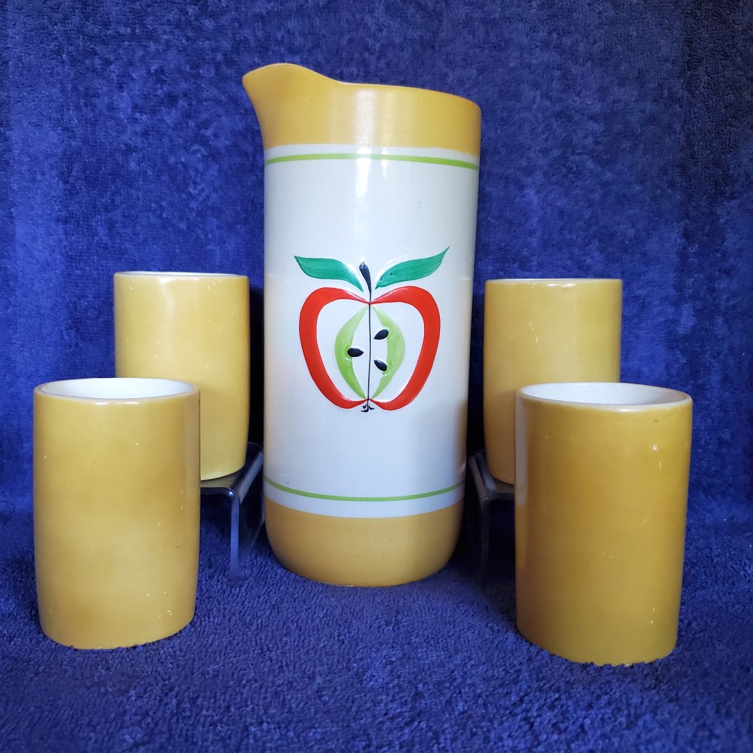 Juice carafe with matching glasses.