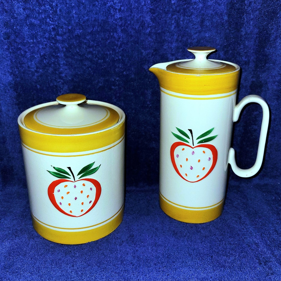 Strawberry-patterned cookie jar and coffee server.