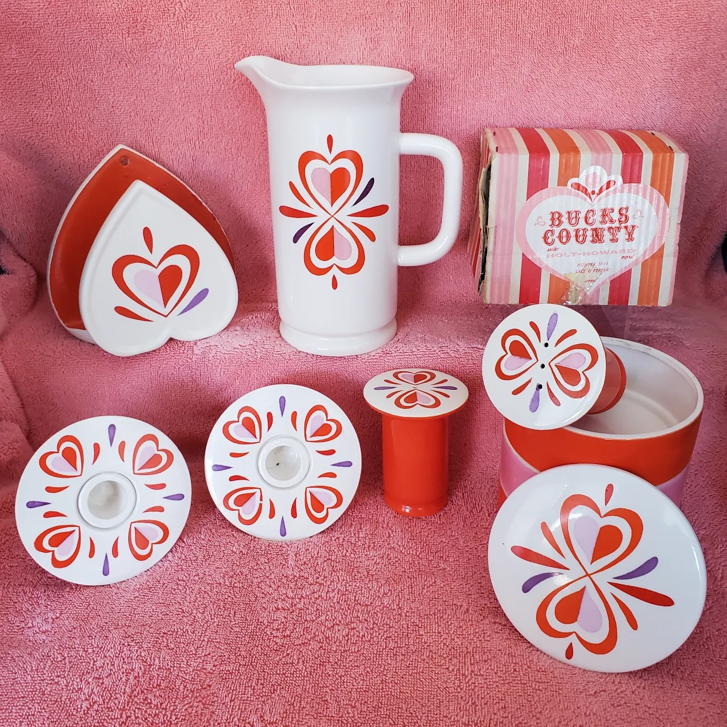 Selected Bucks County pieces against a pink background