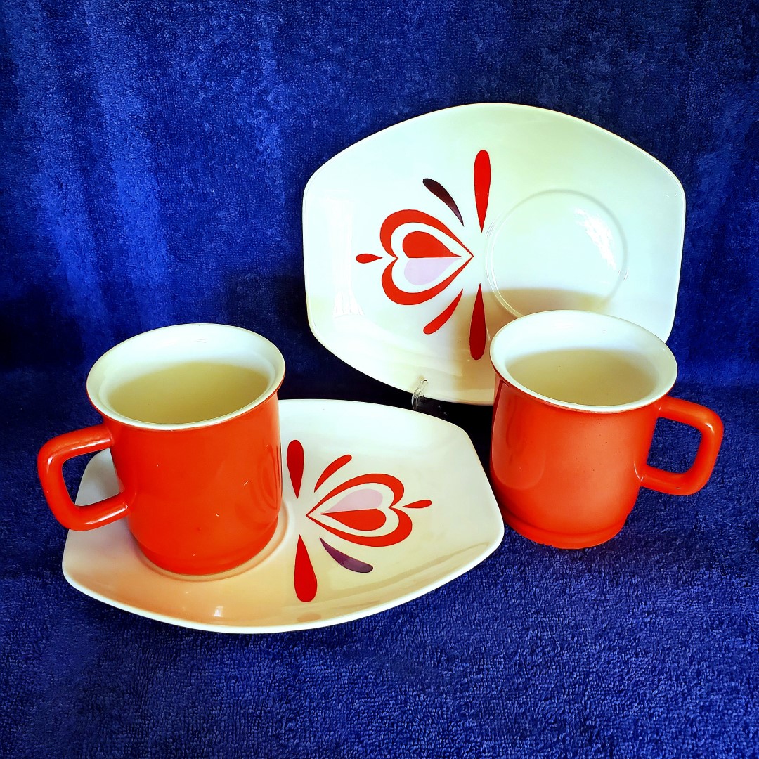 Two Bucks County snack dishes and matching mugs