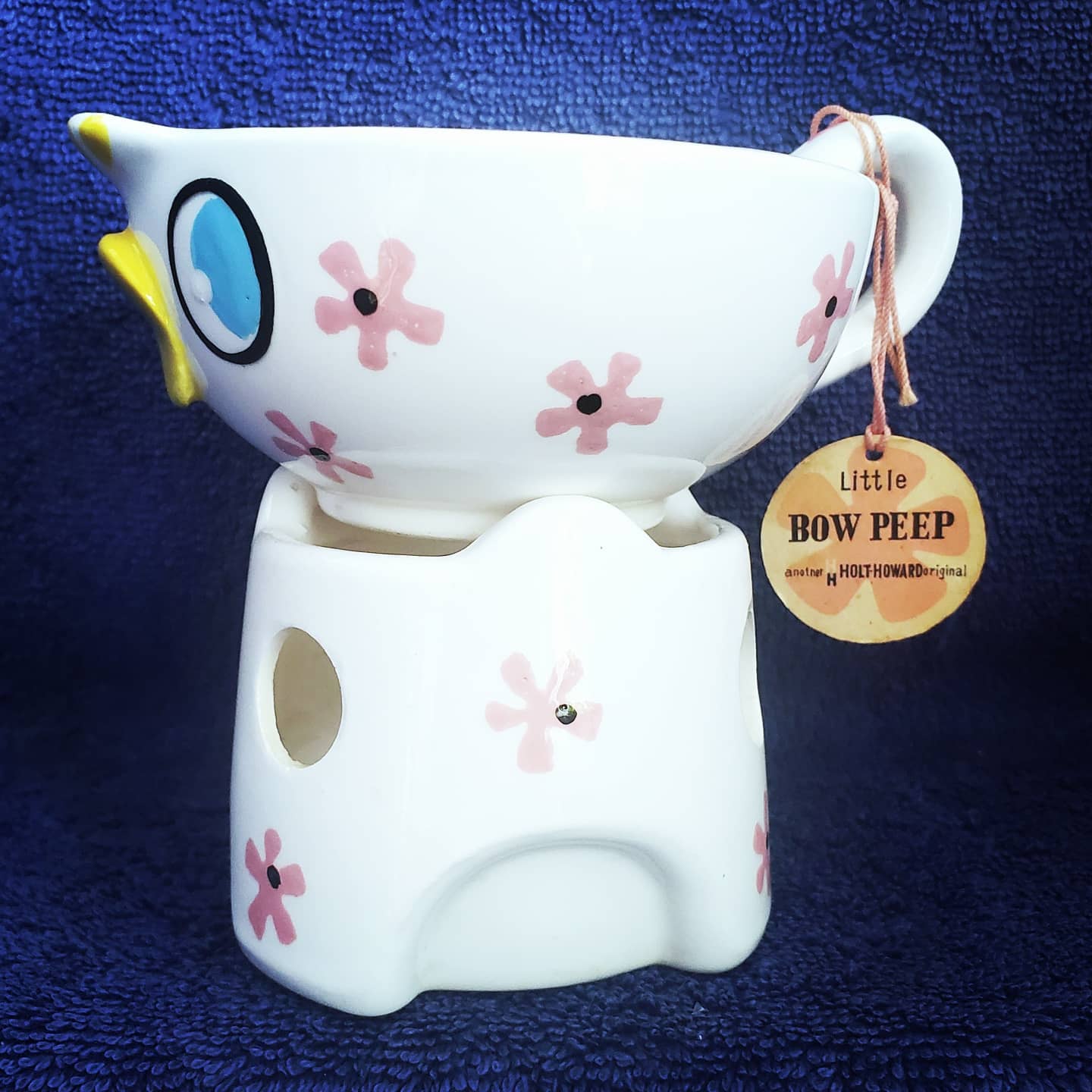 Side view of the sauce warmer with its original Little Bow Peep hang tag