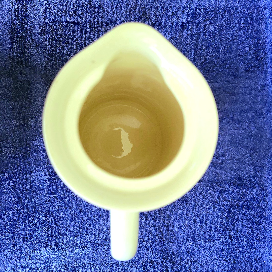 Interior and pouring spout of the Coq Rouge Coffee Server.