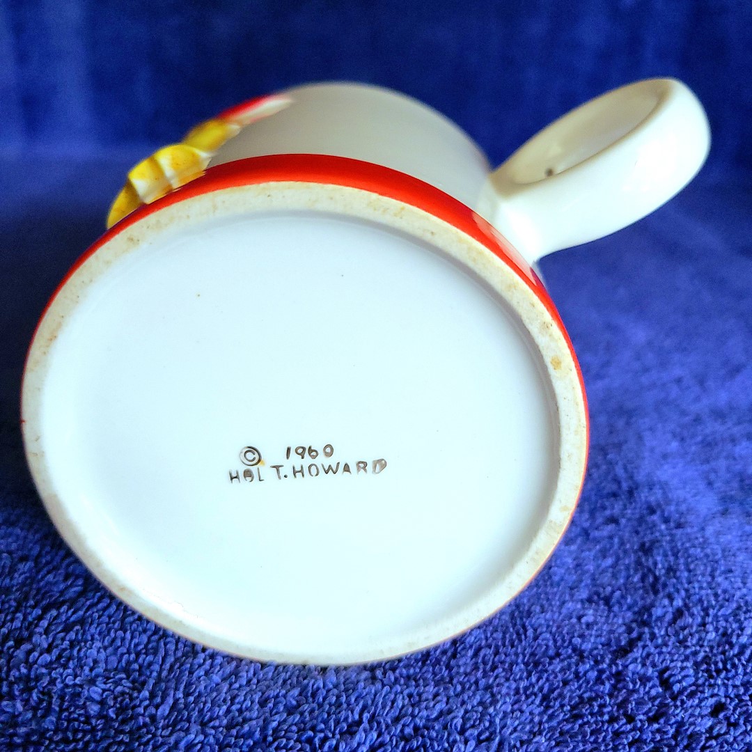 1960 Holt Howard backstamp on straight-sided ring-handle Coq Rouge coffee mug.