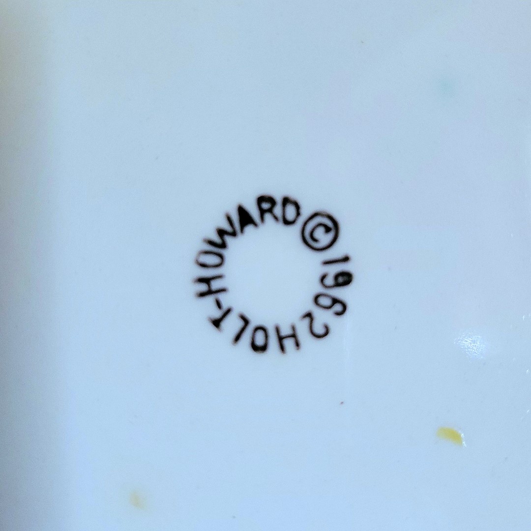 Close-up of 1962 Holt Howard backstamp on Coq Rouge luncheon plate.