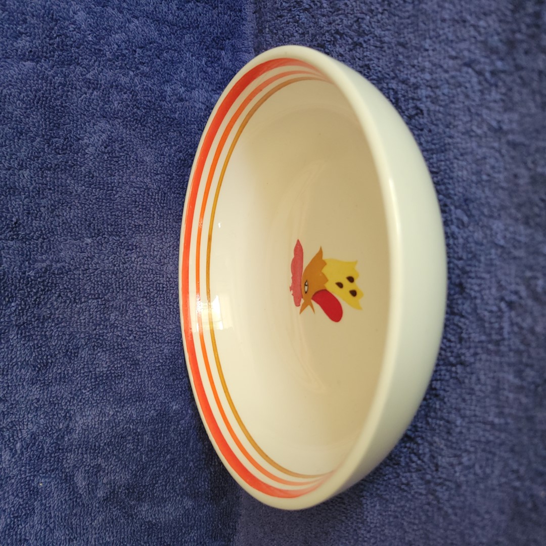 Side view of Holt Howard Coq Rouge cereal bowl.