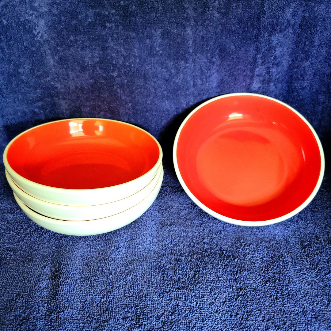 Set of Holt Howard Coq Rouge red-interior bowls.