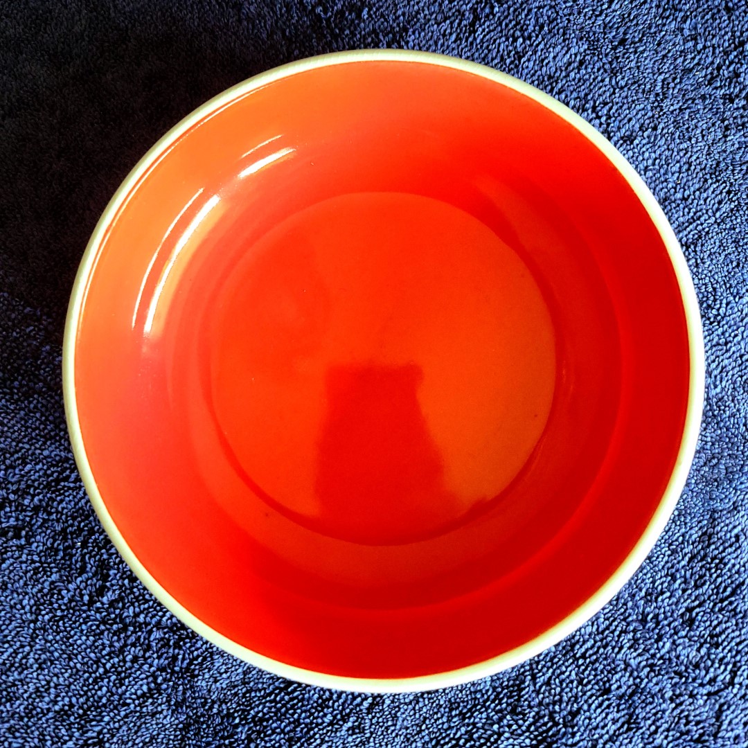 Top view of Holt Howard Coq Rouge red-interior bowl.