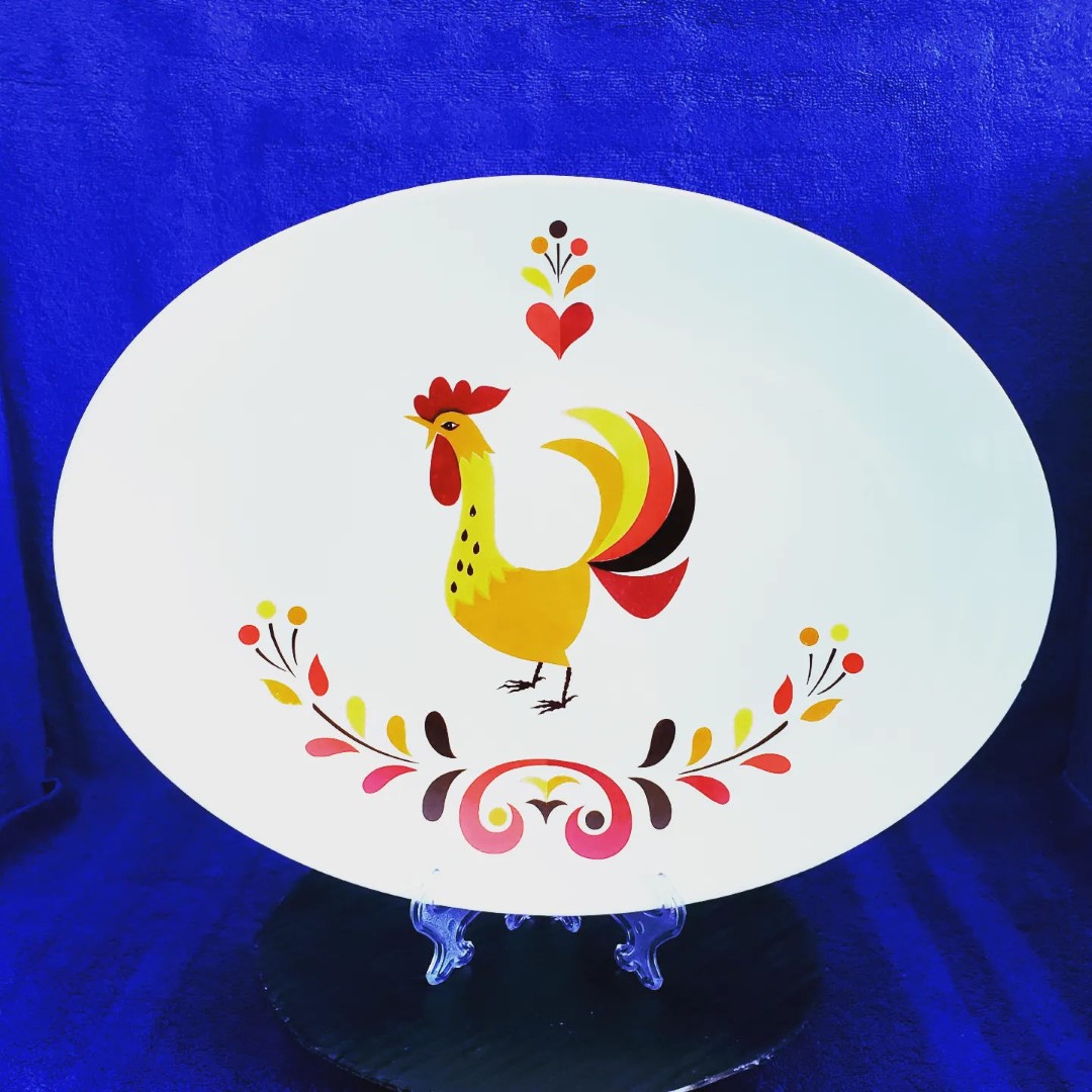 Holt Howard Coq Rouge 12.5-inch oval serving platter with rooster and floral decoration.