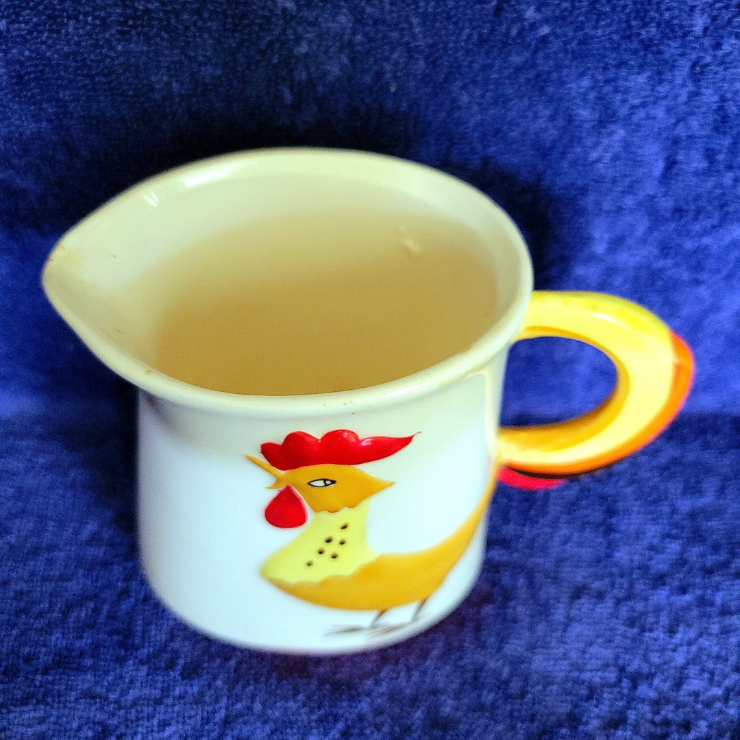 Side view of small Coq Rouge pitcher.