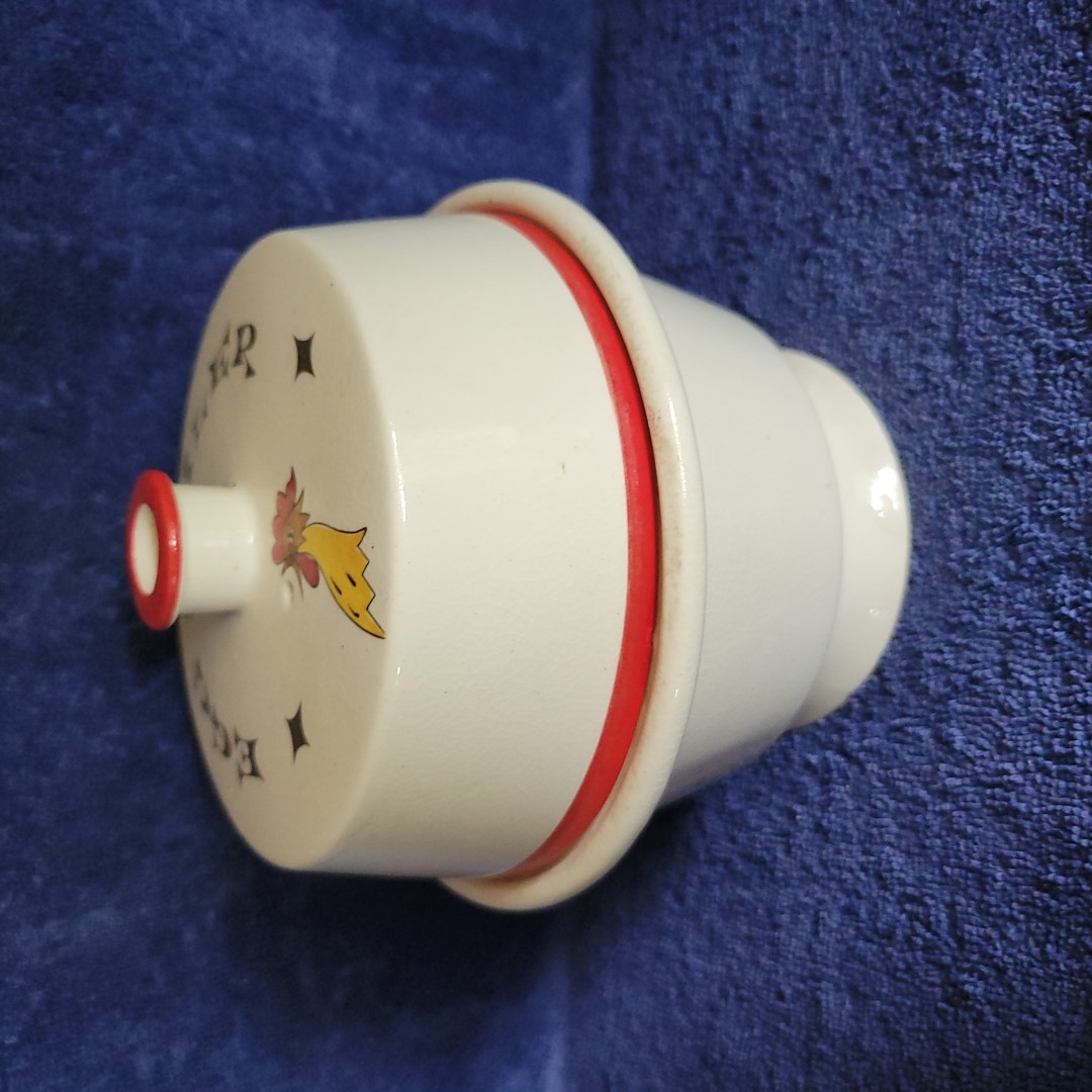 Side view of Holt Howard Coq Rouge electric egg boiler.