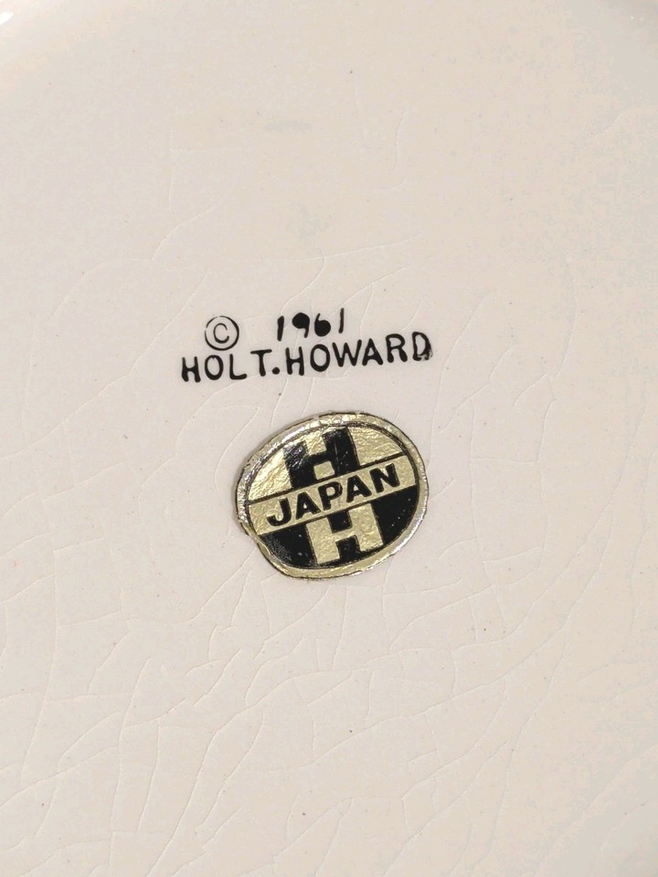 Close-up of 1961 Holt Howard backstamp and foil label on Coq Rouge cookie jar.