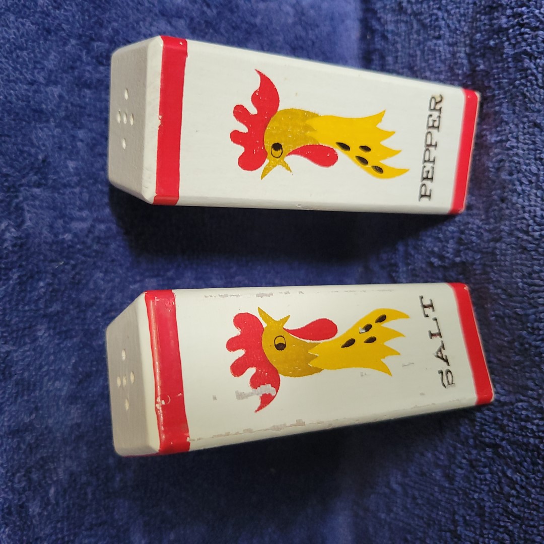 Coq Rouge wooden salt and pepper shaker set.