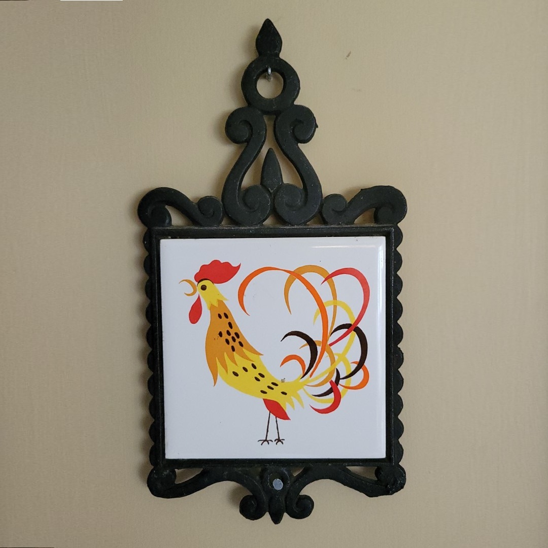 Holt Howard Coq Rouge square ceramic tile trivet in black metal frame.