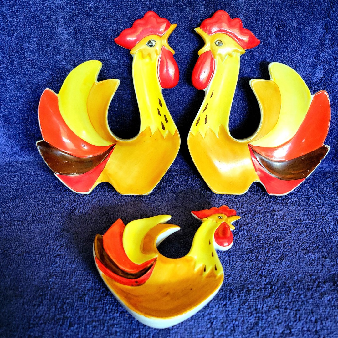 Holt Howard Coq Rouge large and small rooster nut dishes shown together.