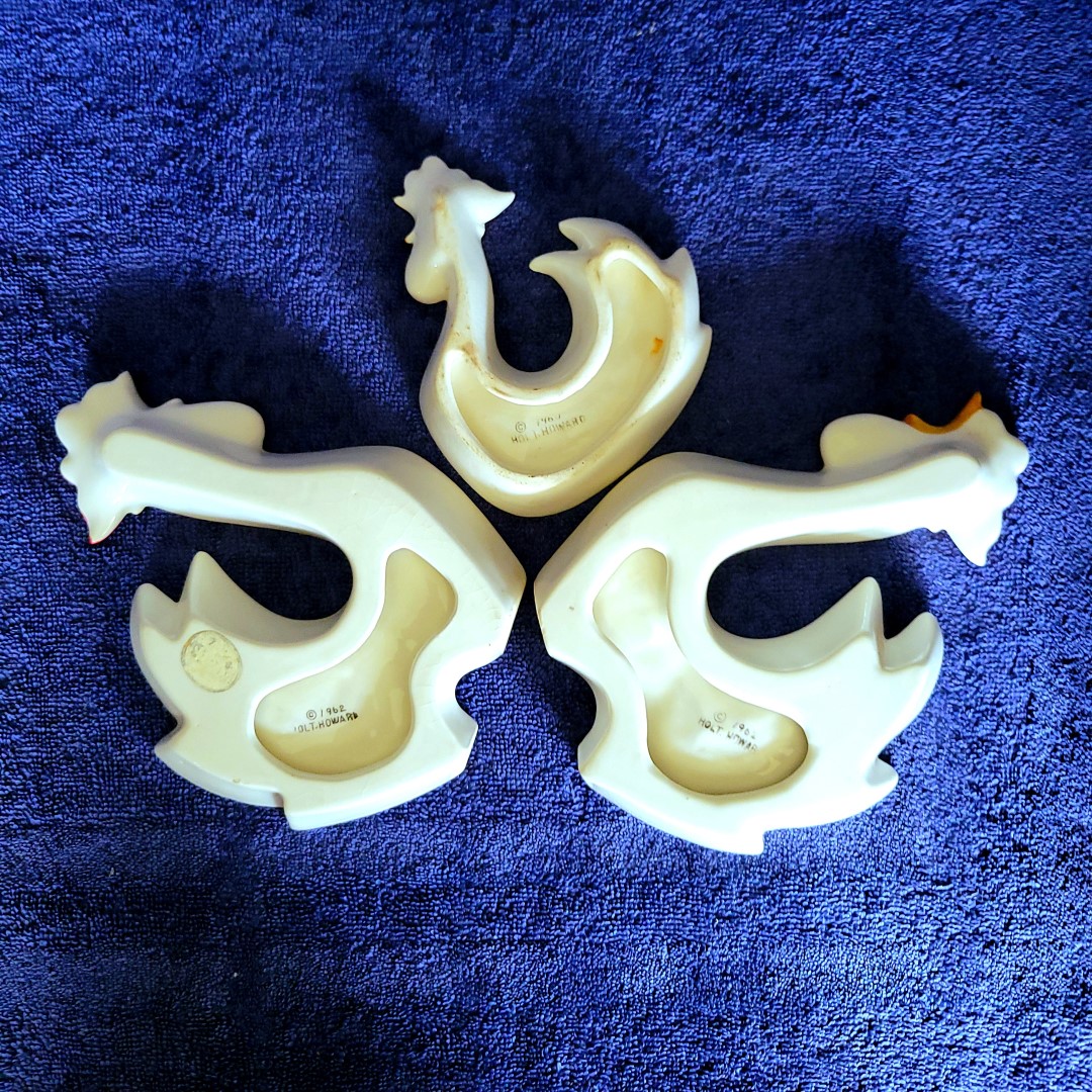 Undersides of Holt Howard Coq Rouge large and small nut dishes.
