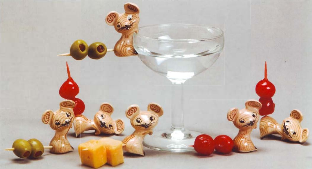 Merry Mouse Cocktail Kibitzers arranged around a cocktail glass, as illustrated in Walter Dworkin's second-edition collector guide.