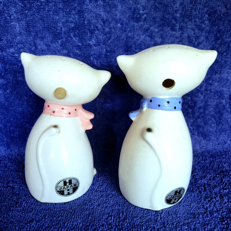 Rear view of Cozy Kittens Siamese Cat salt and pepper shakers showing refill openings and foil labels.