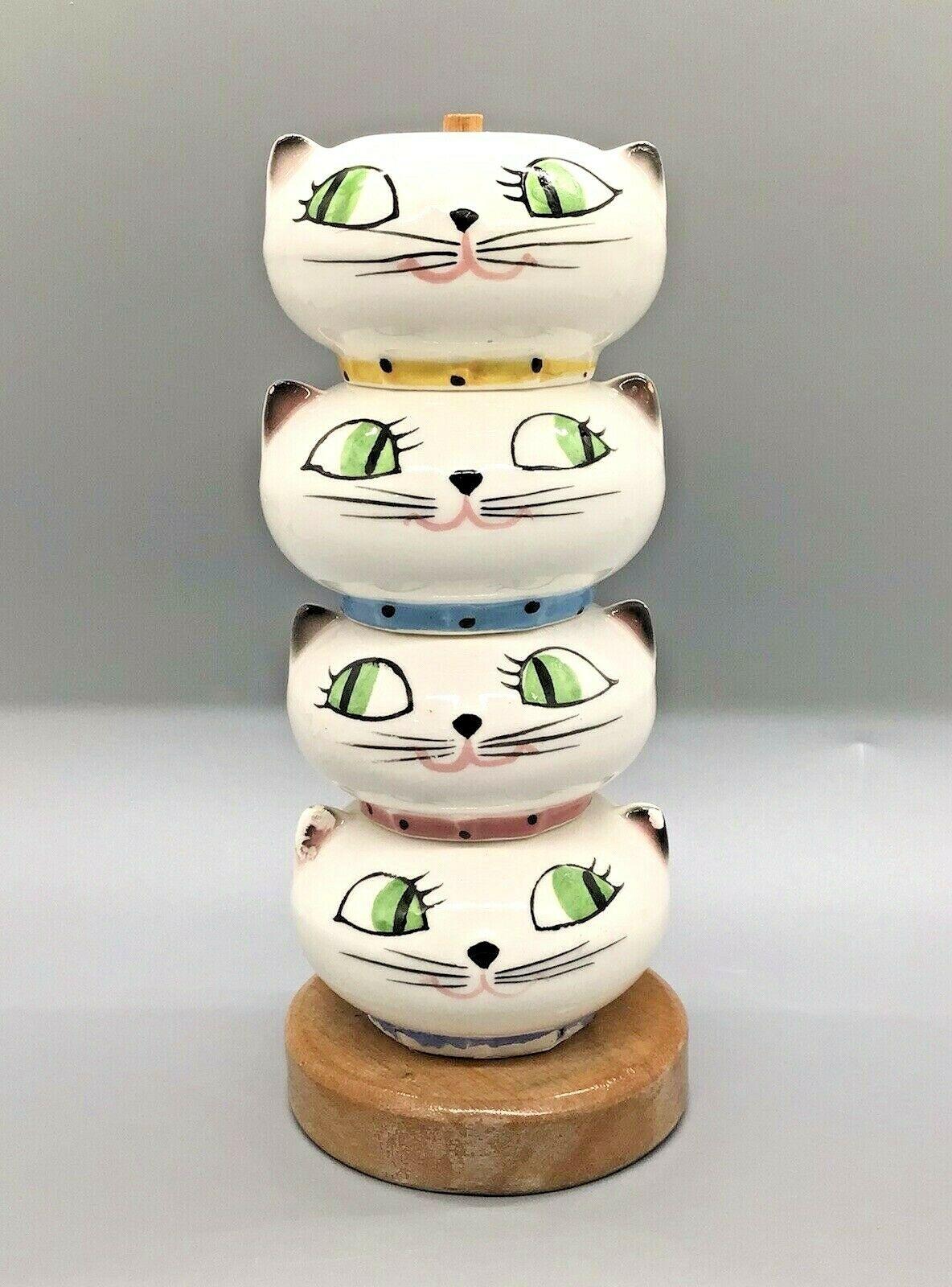 Front view of Holt-Howard Cozy Kittens Stacking Seasons set on wooden base.