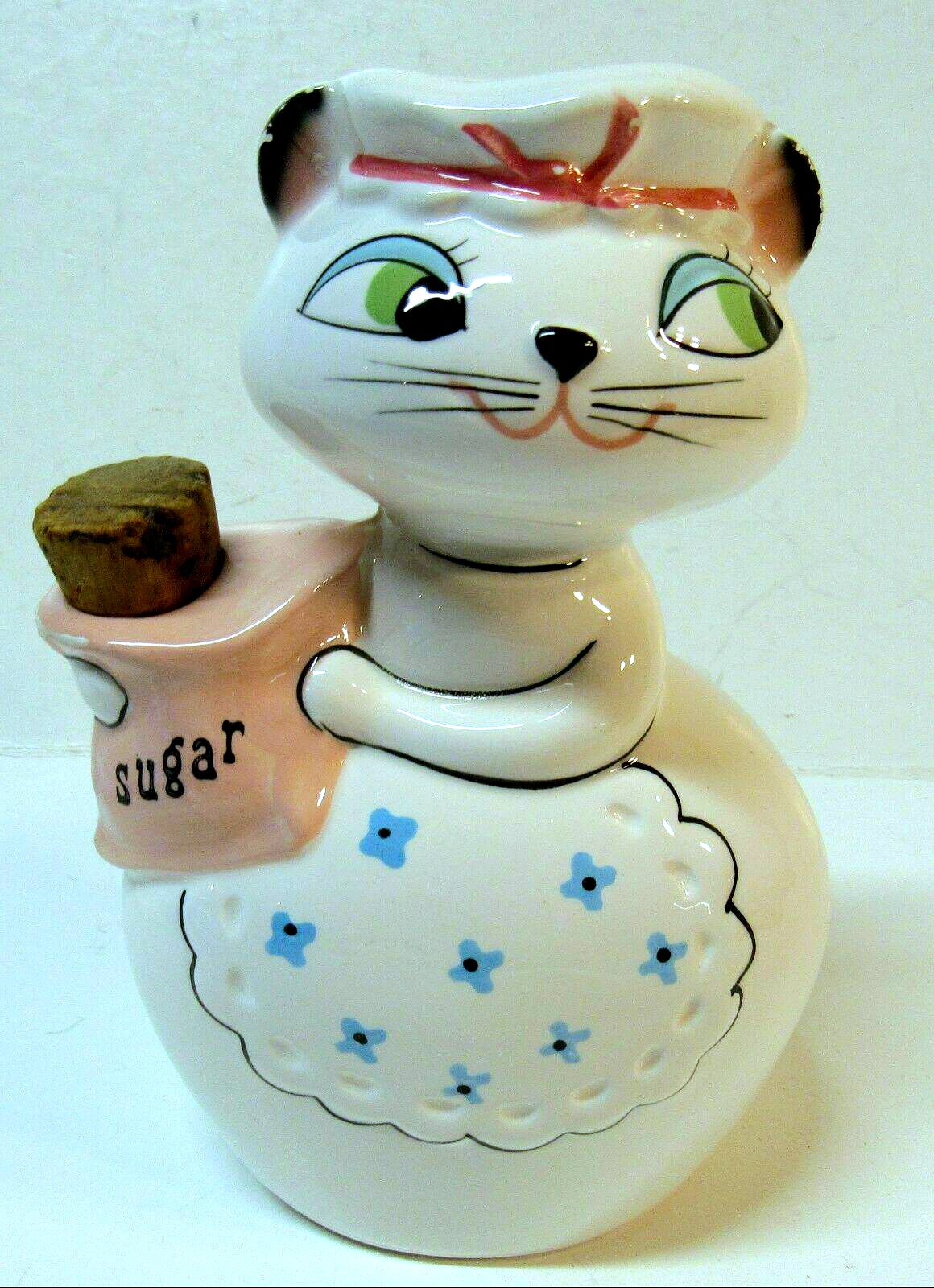Front view of Holt-Howard Cozy Kittens sugar shaker holding a pink sugar sack.
