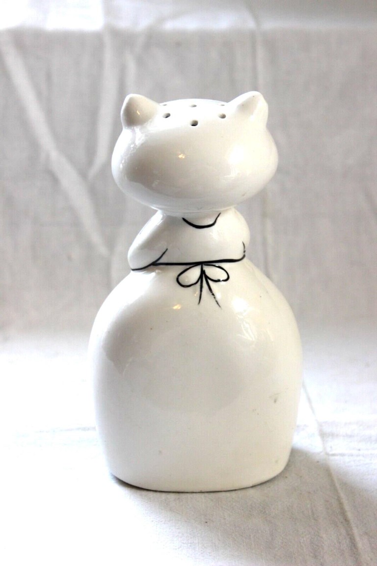 Rear view of Cozy Kittens Powdered Cleanser shaker showing dispensing holes in head.