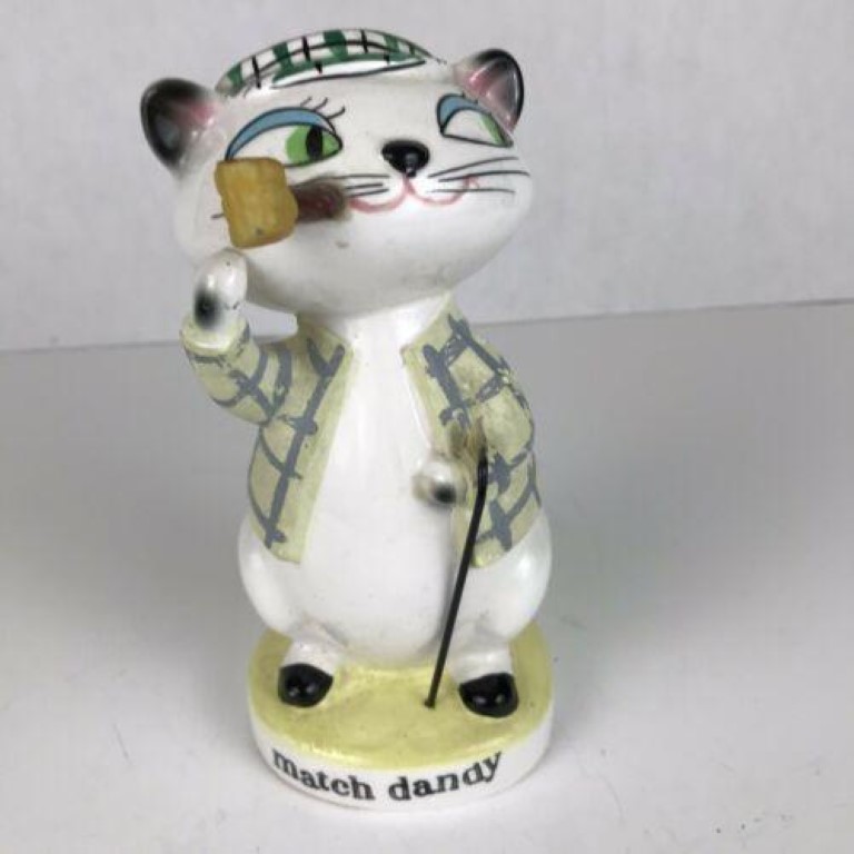 Front view of Holt-Howard Cozy Kittens Match Dandy smoking a pipe and holding cane.