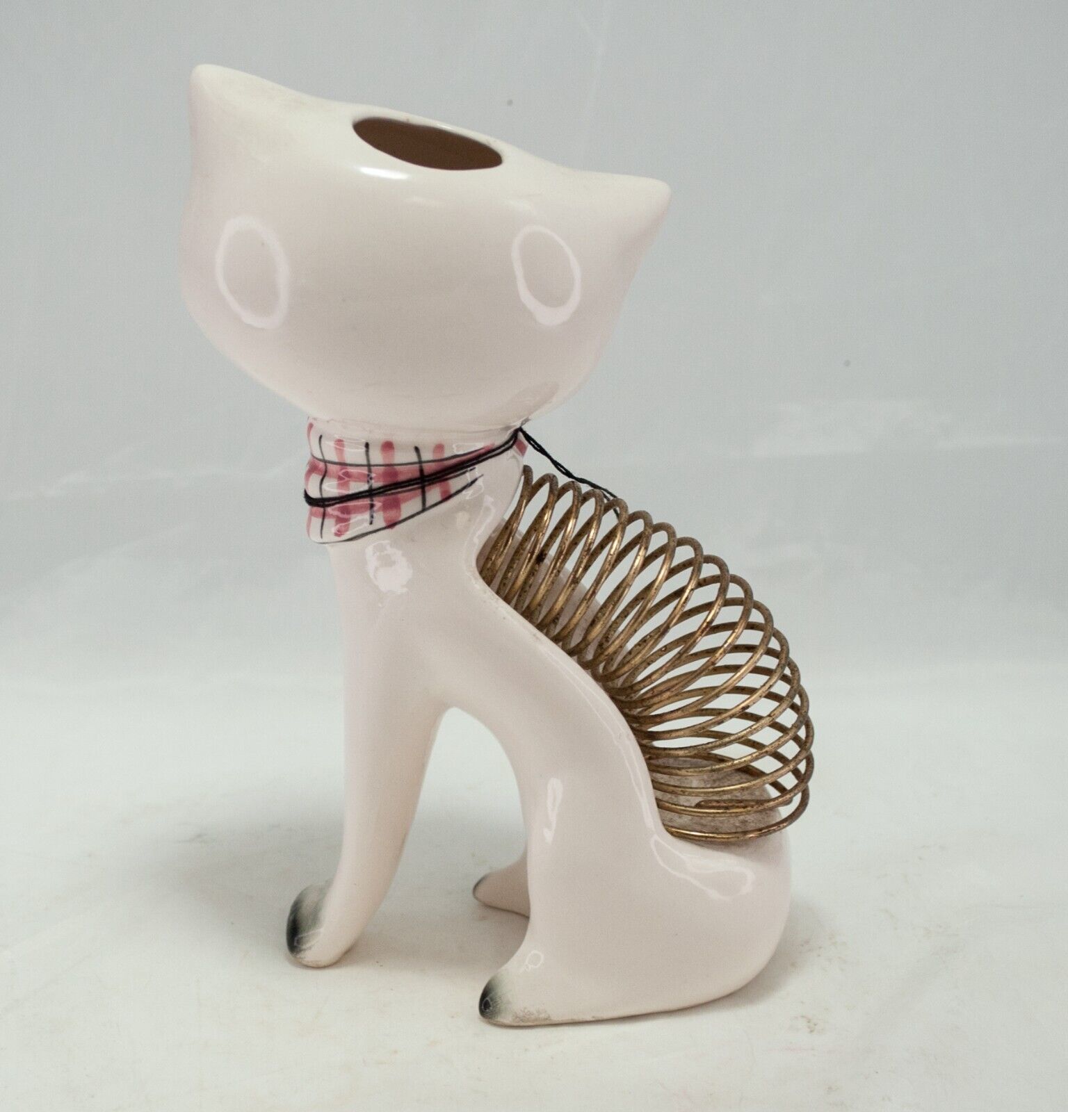 Rear view of Cozy Kittens Caddy showing coil spring and top opening.