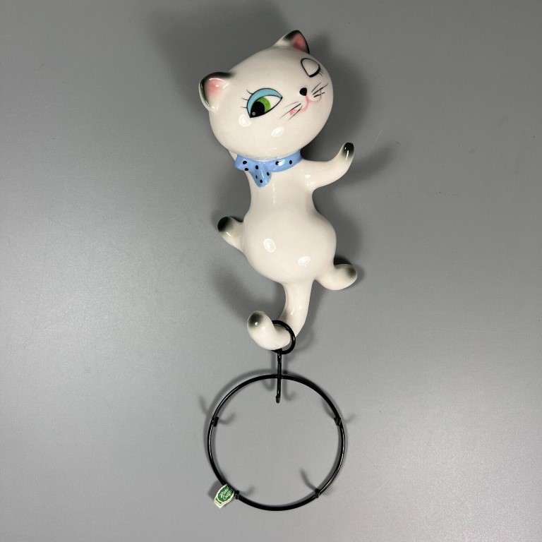 Cozy Kittens Wall Caddy assembled with metal ring hanging from tail.