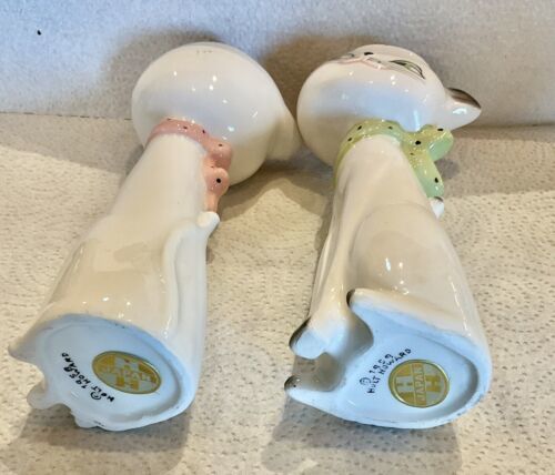 Undersides of Cozy Kittens bud vases showing Holt-Howard marks and Japan foil labels.