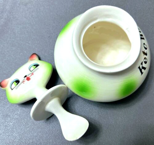 Cozy Kittens Ketchup jar with lid and attached spreader removed.