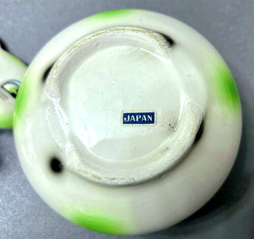 Underside of Cozy Kittens Ketchup condiment jar with Japan label.