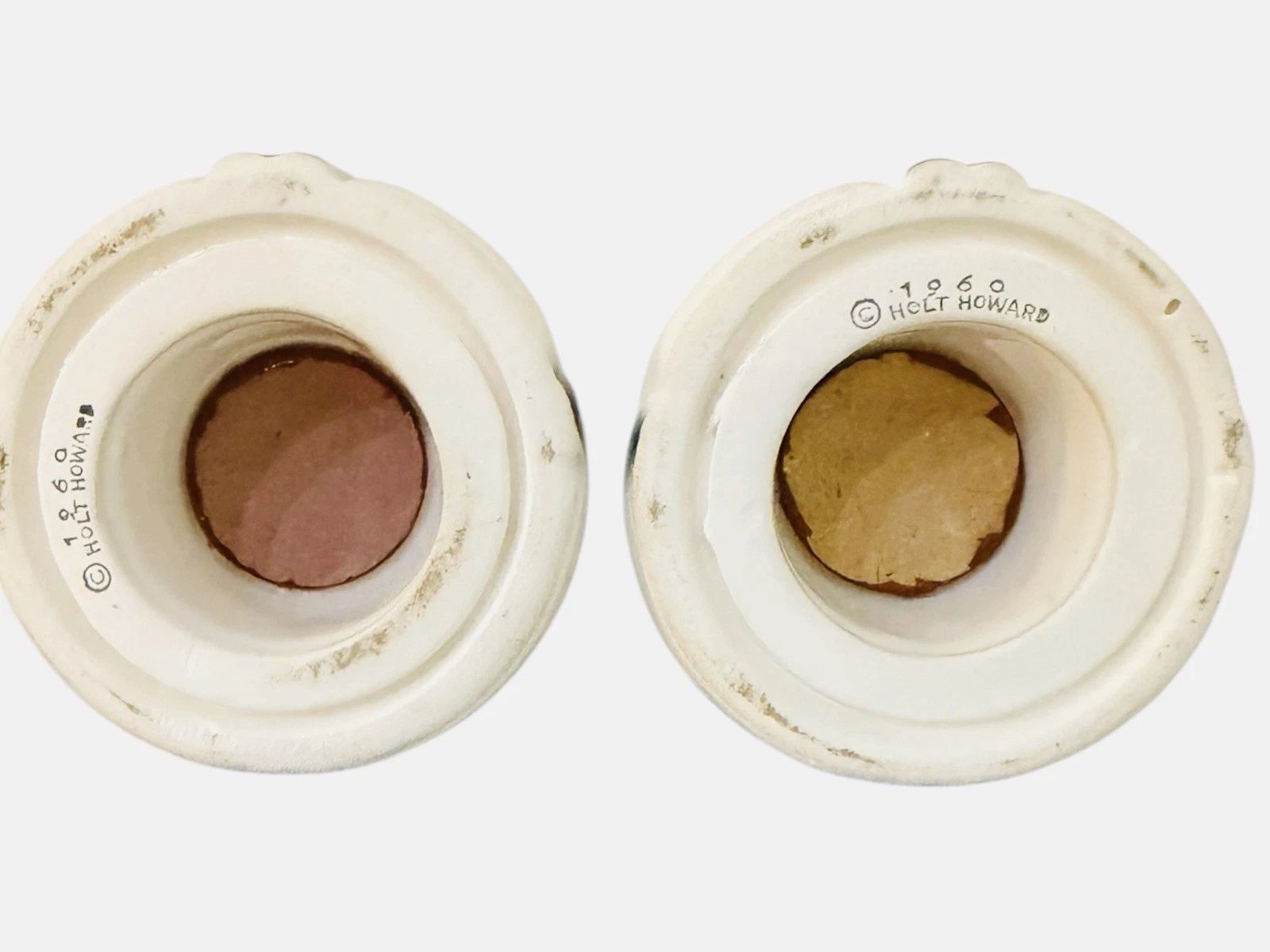 Undersides of Cozy Kittens Meow Oil and Vinegar cruets with 1960 Holt-Howard backstamps.