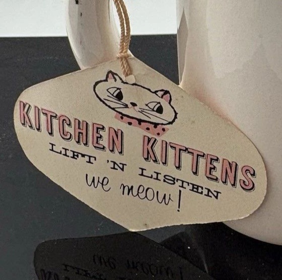 Front of original Cozy Kittens Meow Mug hang tag.