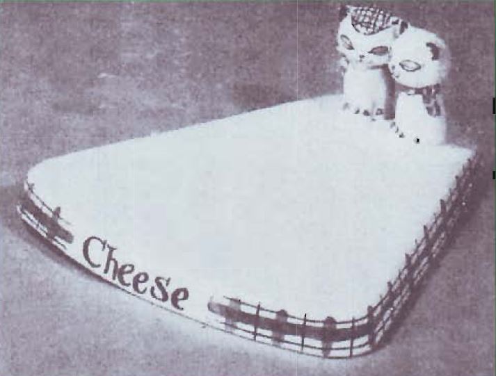 Period catalog image of British Cozy Kittens Cheese Board
