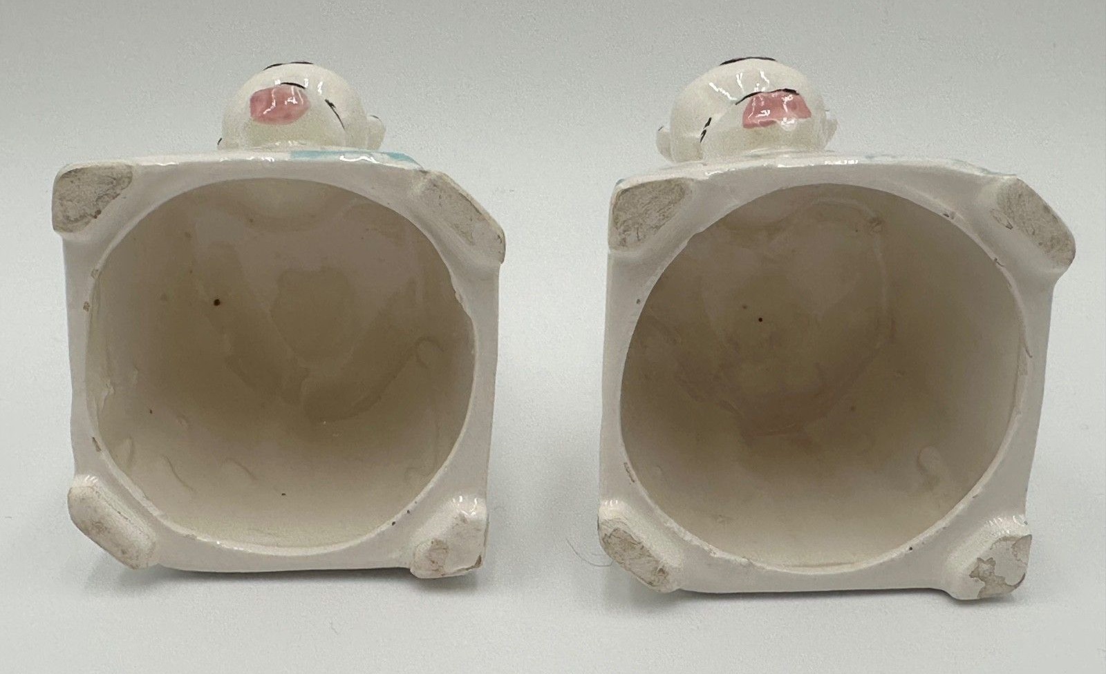 Undersides of Kitchen Cubs Egg Cup seasoning covers.