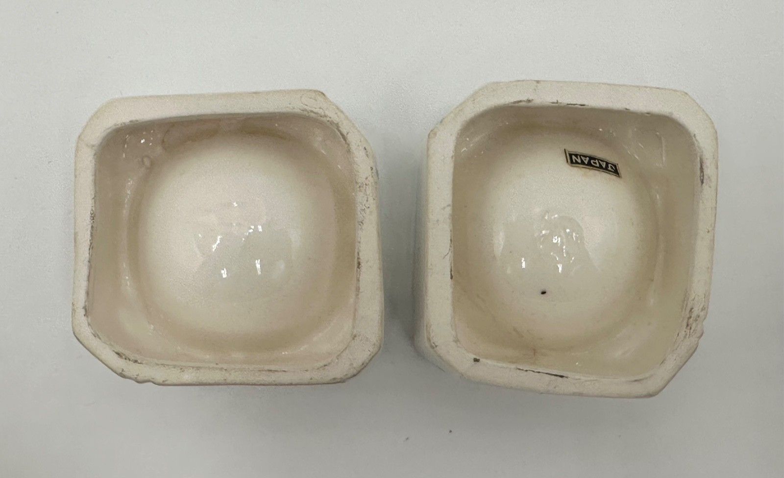 Undersides of Kitchen Cubs Egg Cup bases with Japan label.