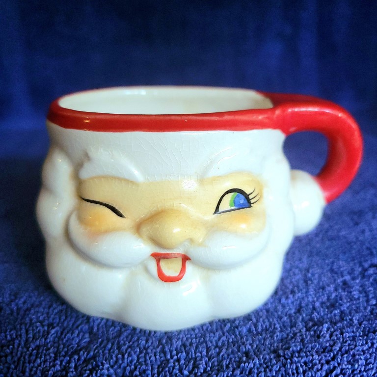Holt Howard Winking Santa Type A mug, front view.