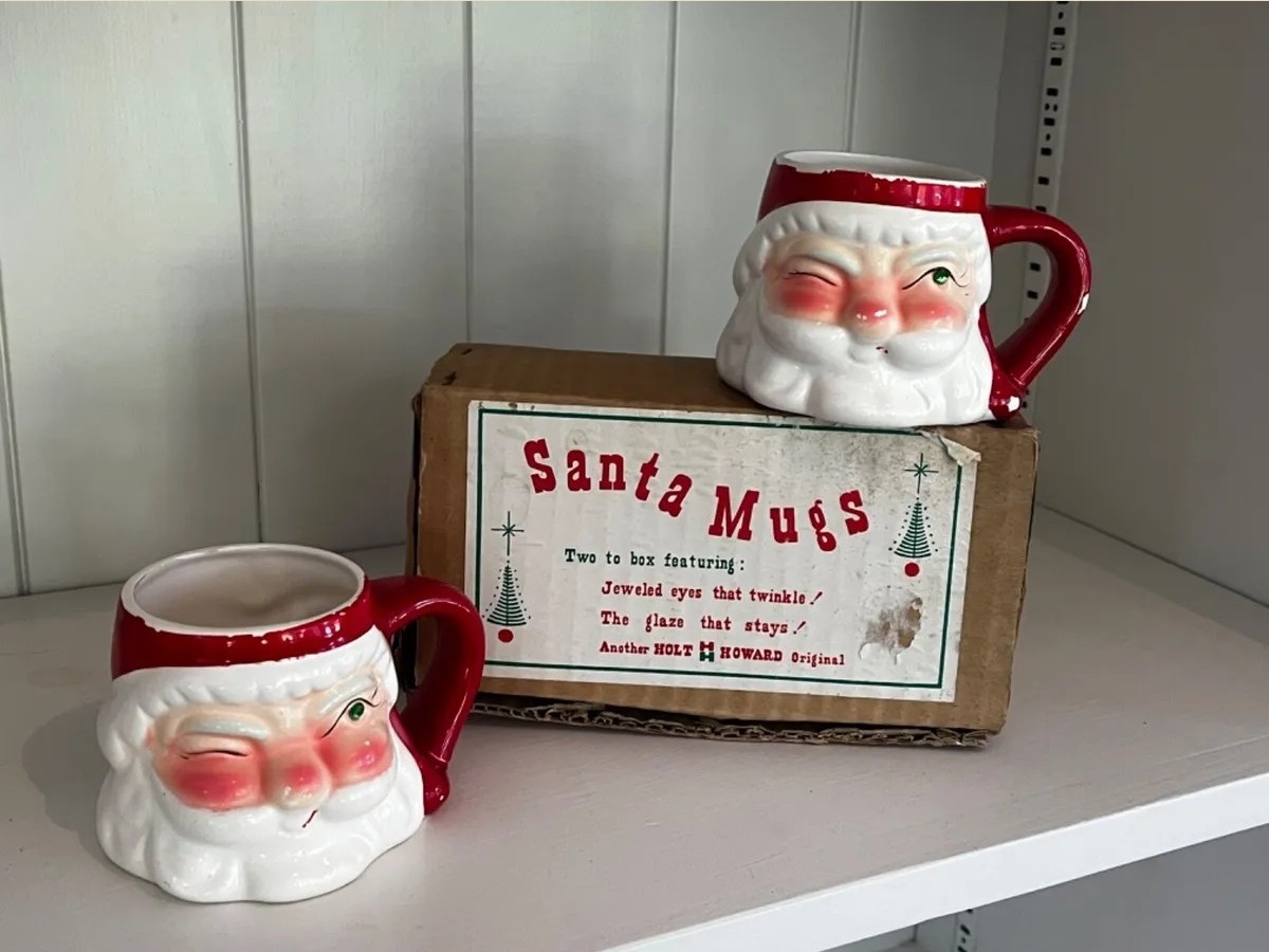 Pair of Holt Howard Jeweled Eye Santa mugs displayed with their original box.