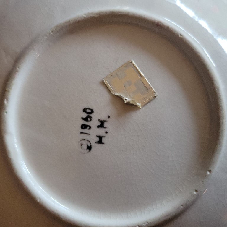 Underside of Holt Howard Winking Santa Type A candle plate.