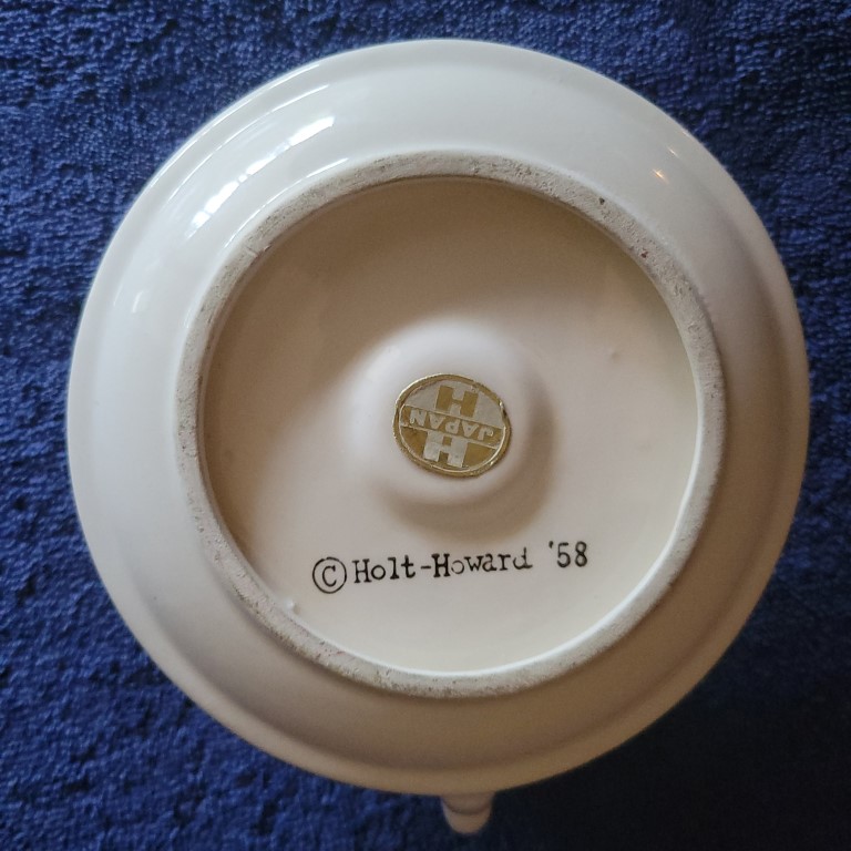 Underside of Holt Howard Winking Santa Type B candle plate.