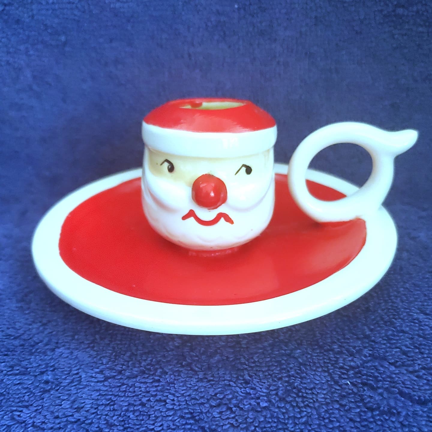 Holt Howard Mid-Century Modern Mustache Santa candle plate, front view.