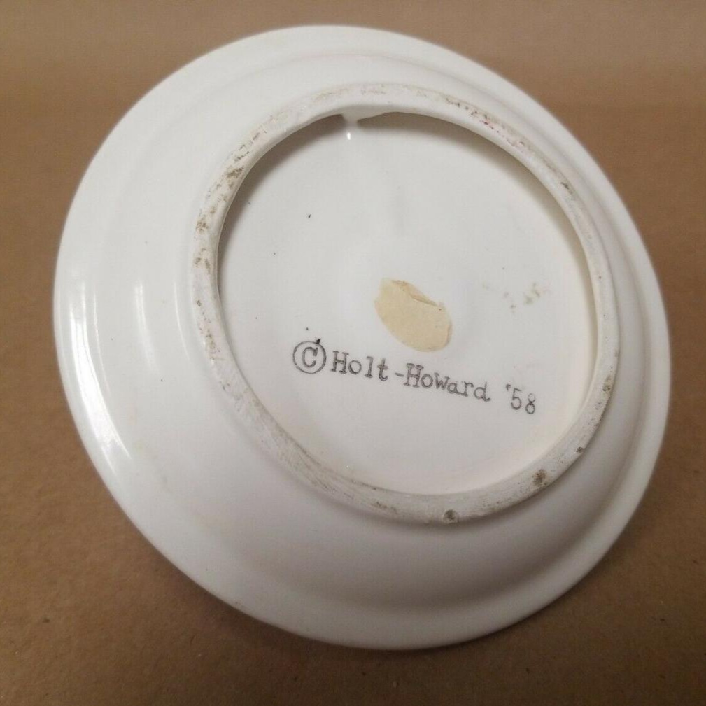 Underside of Holt Howard Mid-Century Modern Mustache Santa candle plate.