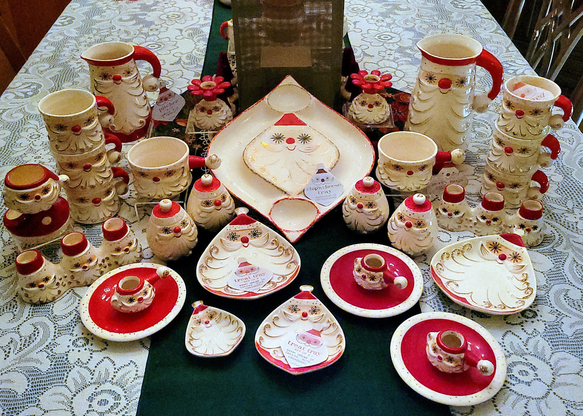 Collection of Holt Howard Starry-Eyed Santa ceramics displayed together.