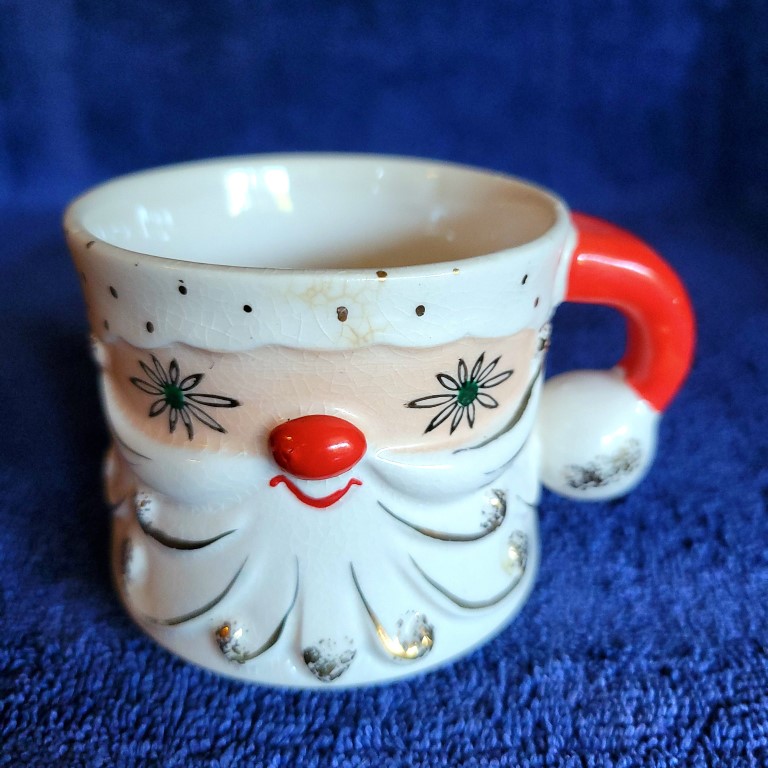 Holt Howard Starry-Eyed Santa curved handle mug.