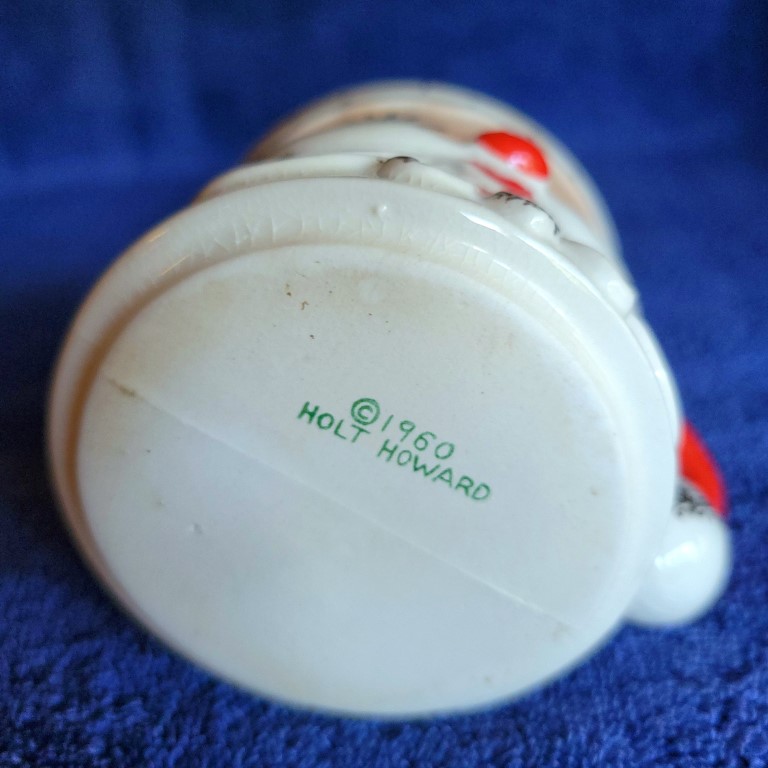 Underside of Holt Howard Starry-Eyed Santa curved handle mug.